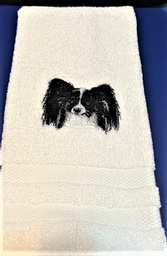  Beautiful stitched B& W papillon on a white hand towel